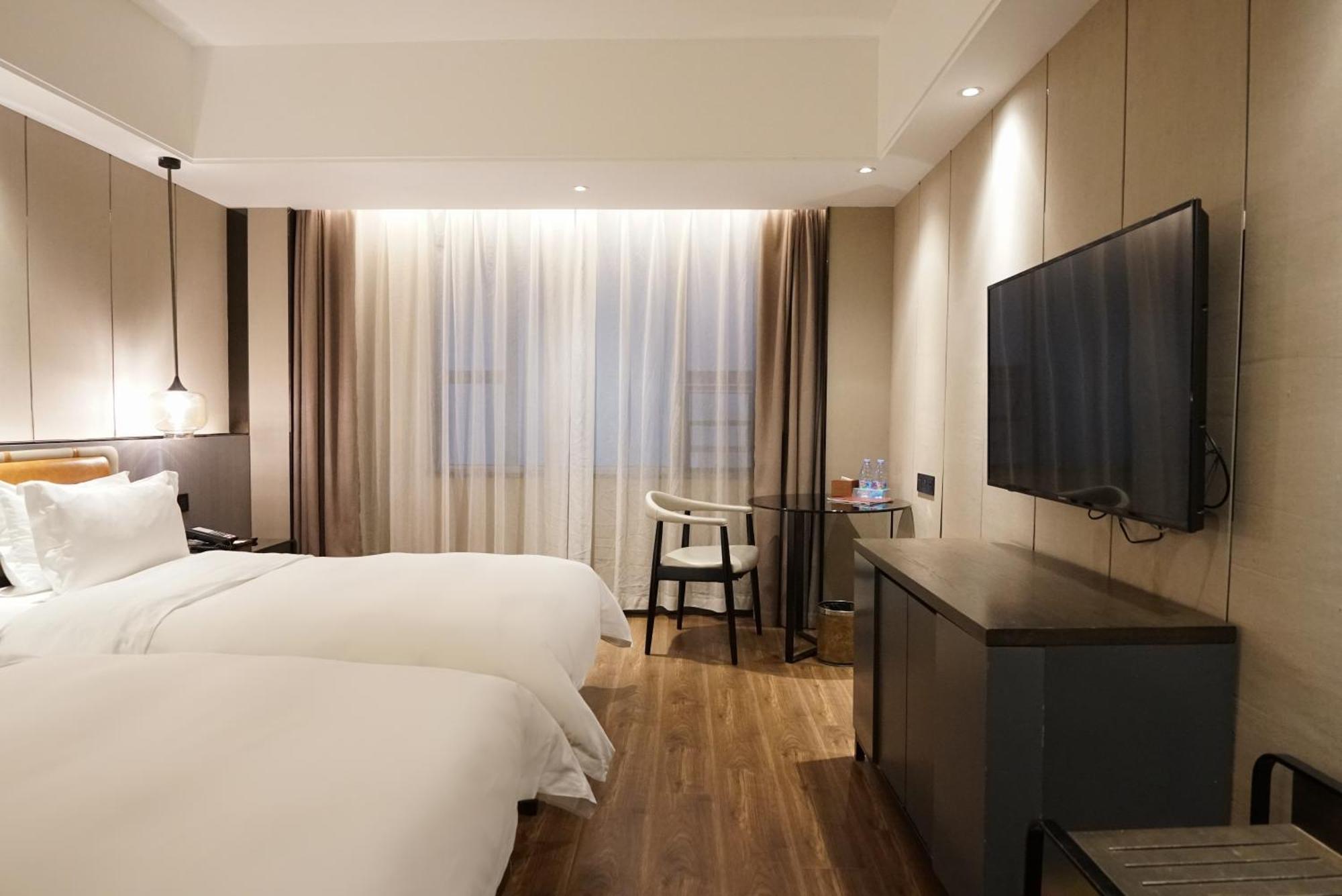 Paco Hotel Datang Metro Canton Extérieur photo